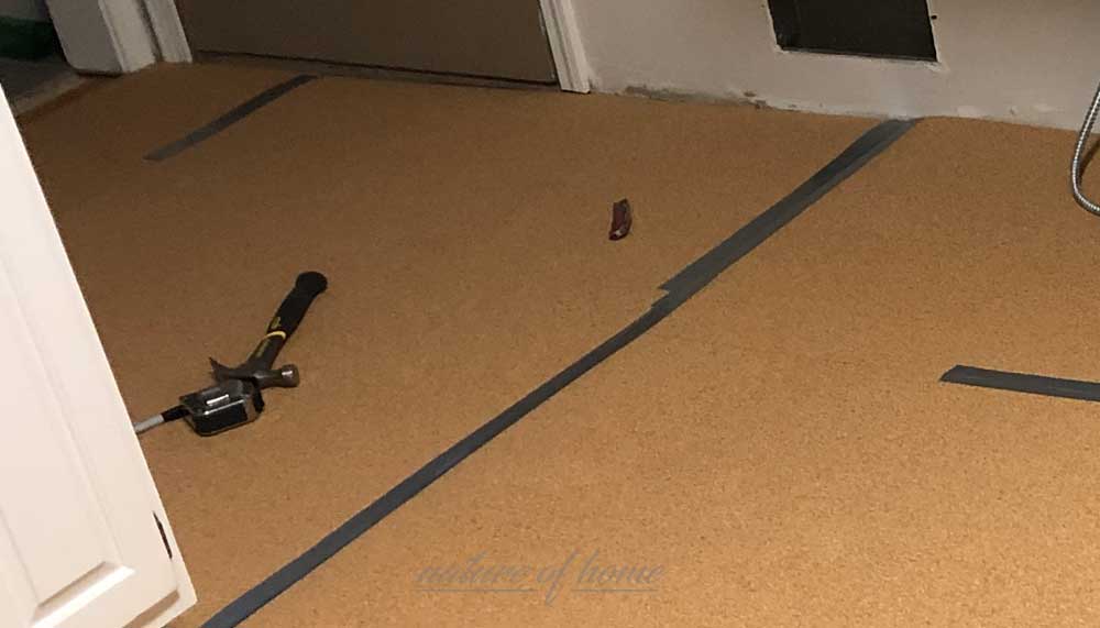 How to Install Cork Underlayment 4 taping seams of cork underlayment