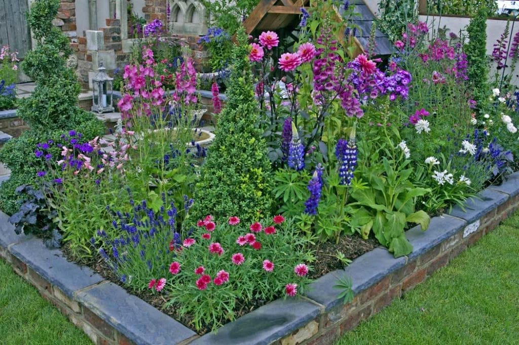 Home - stone raised bed garden idea