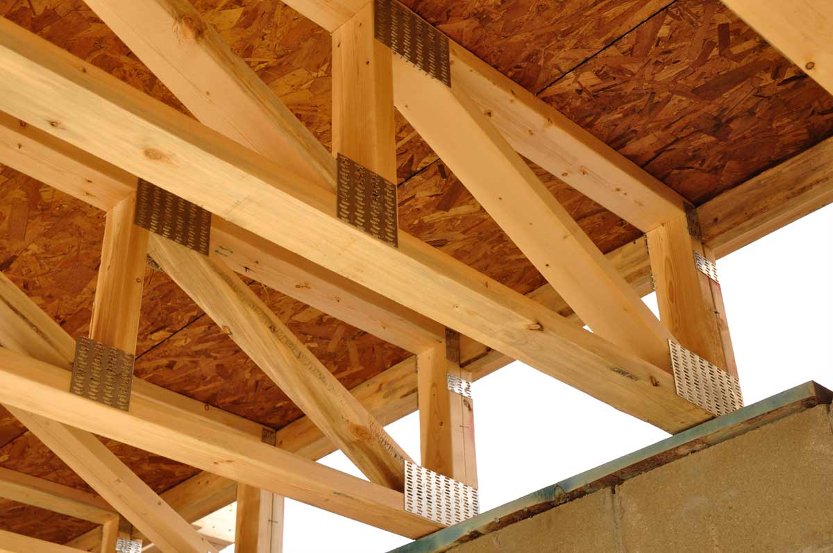 Rim Joist: Purpose, Insulation & Common Mistakes 2 floor trusses ready for rim joist