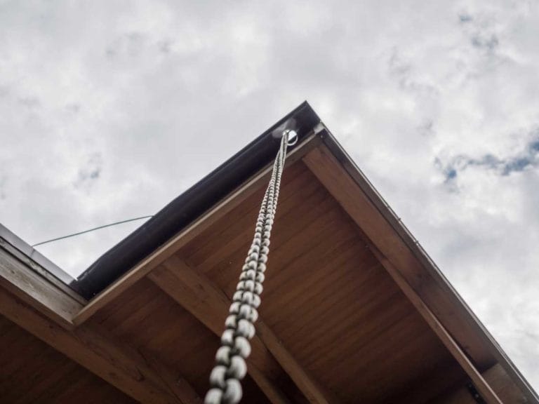 Rain Chains: What They Are + Why You Need One + How to Make Your Own 5 rain chain installed on a gutter
