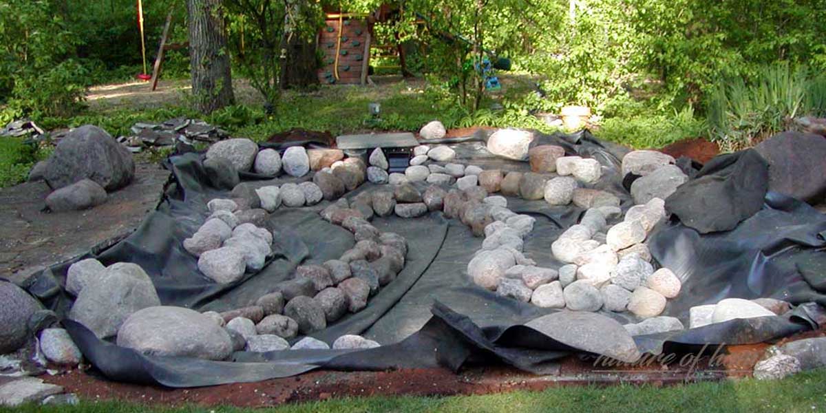 Koi Pond Guide: Ideas & Tips for Building Your Dream Pond 8 installing koi pond liner