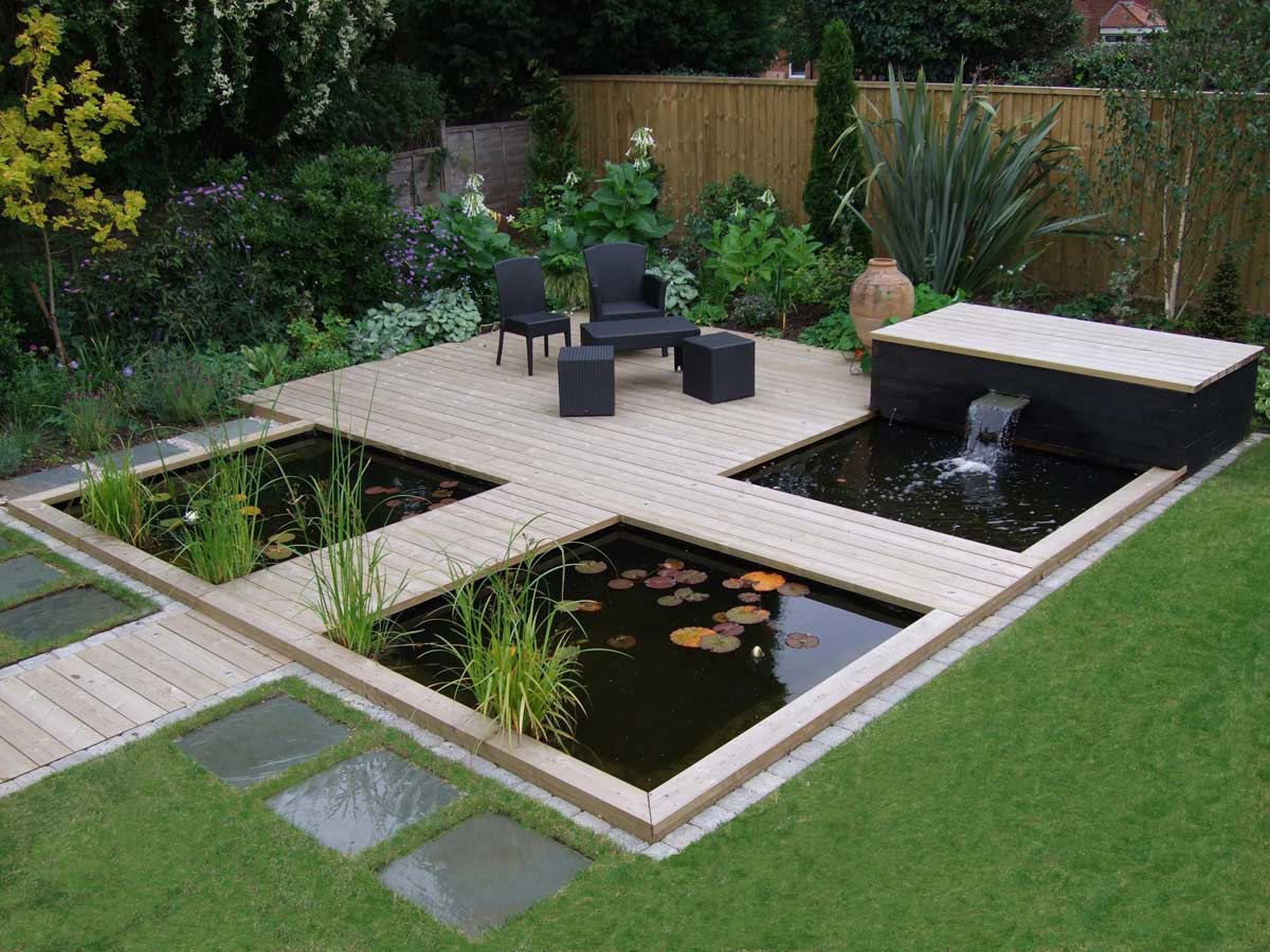 Koi Pond Guide: Ideas & Tips for Building Your Dream Pond 3 modern koi pond with patio