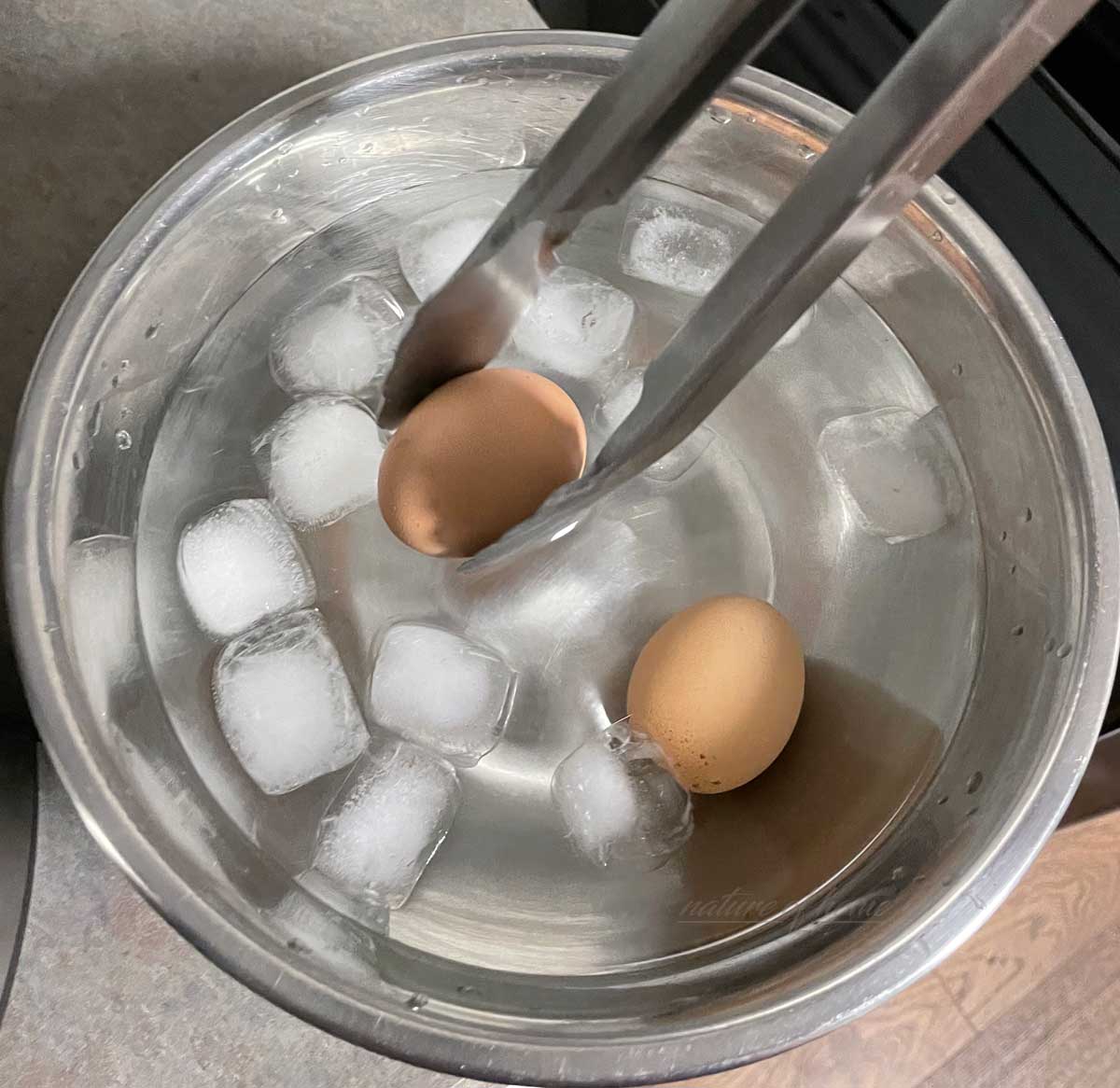 Instant Pot Hard Boiled Eggs (12 Easy Steps for Perfect Results) 8 placing eggs into ice water to cool
