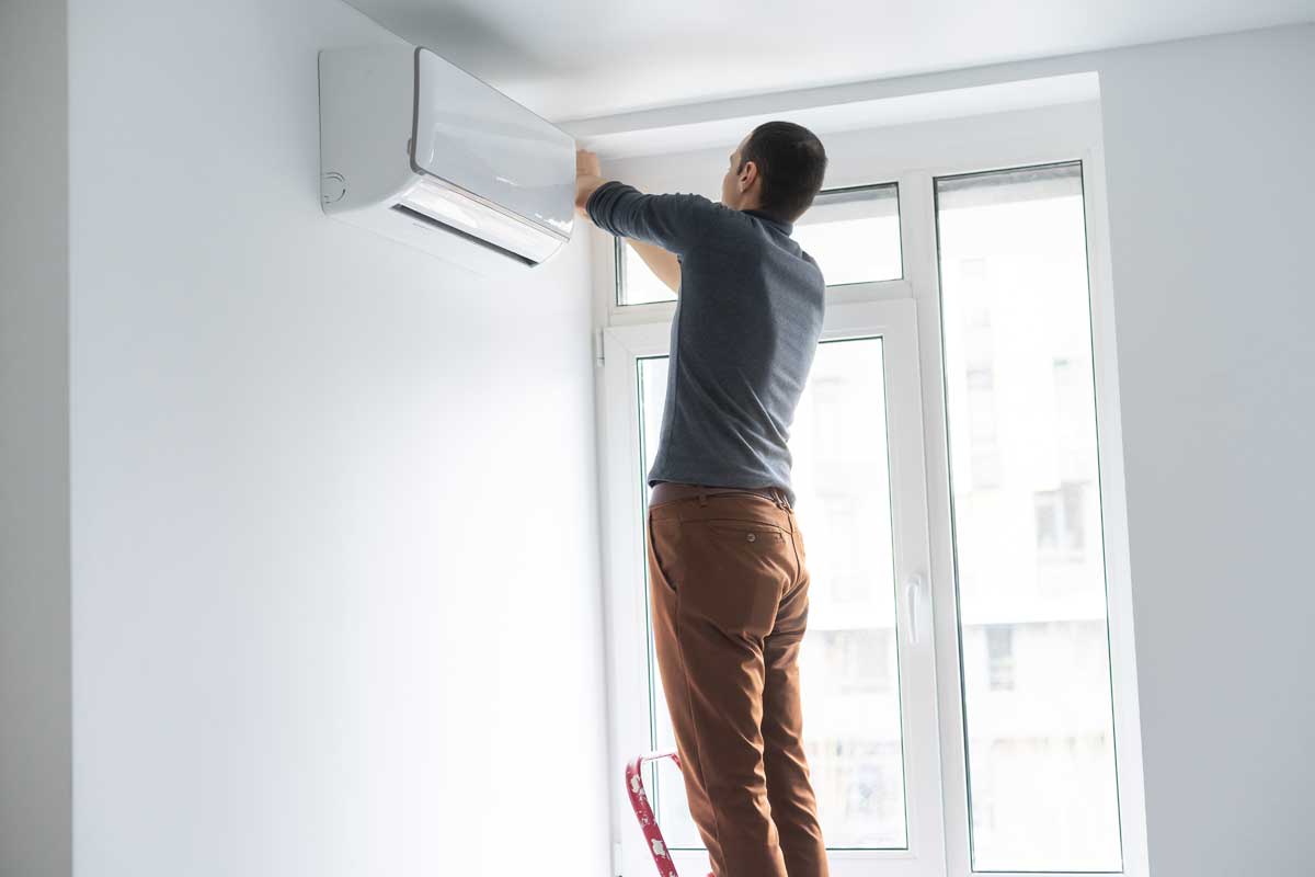 Mini Split- Ductless Heating & Air Conditioning: What It Is + Why You Need One 3 man working on ductless mini split air conditioner