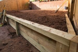 Garden Leveling: Leveling a Sloping Garden (Step-by-Step) 1 leveling a garden with a retaining wall