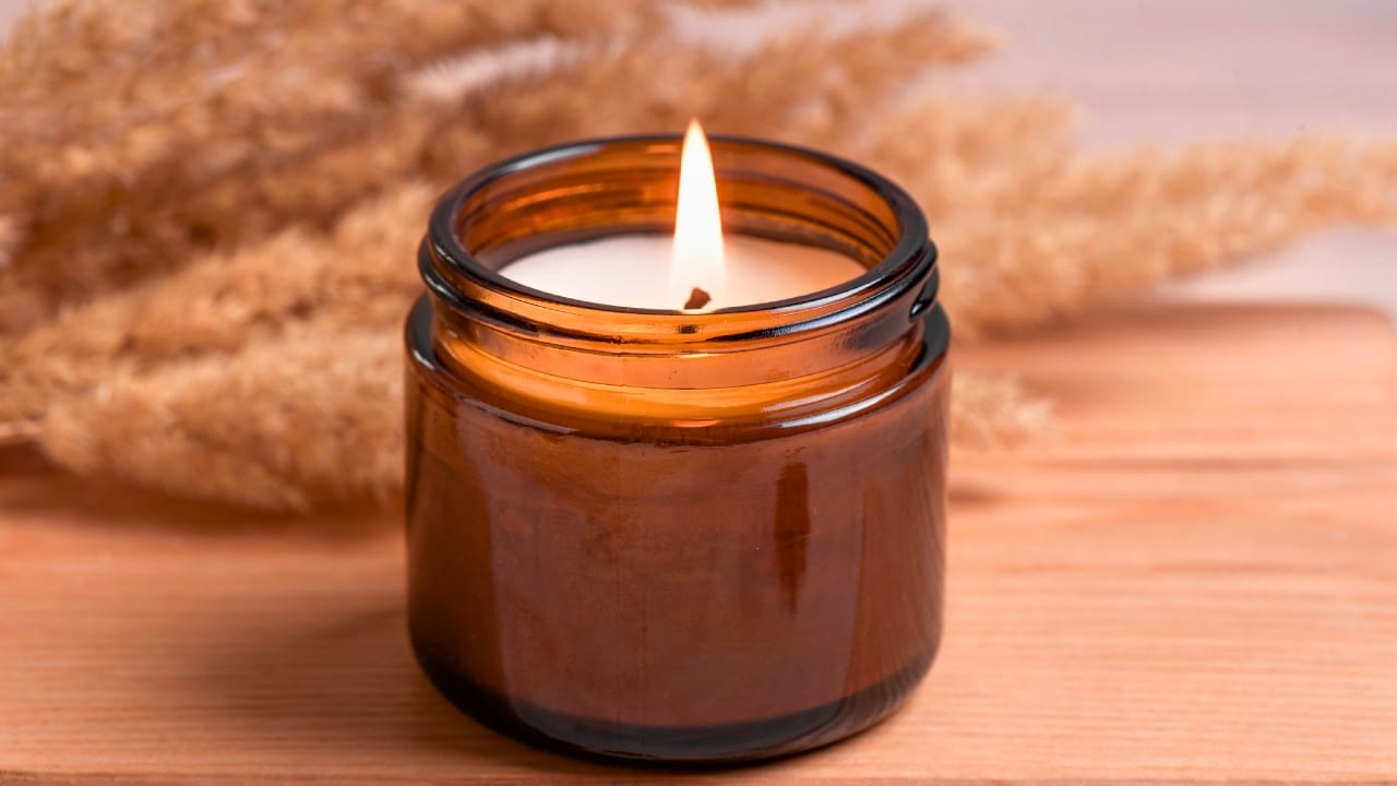 Are Scented Candles Really Harmful? Here’s What Science Says 2 Are Scented Candles Really Harmful? Here’s What Science Says - Cozy burning candle in amber glass jar ss2454019177 degm