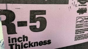 What Is R-Value For Insulation? Explained & Myths Debunked 1 showing r-value on pink insulation foam board