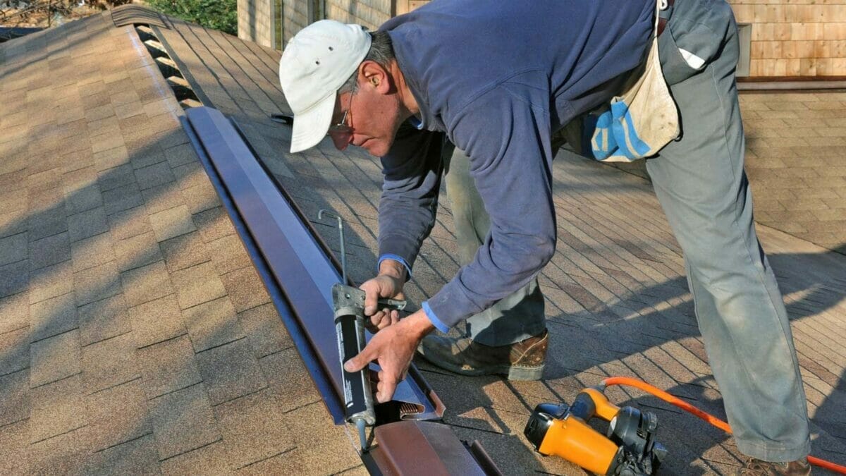 man installing roof ventilation