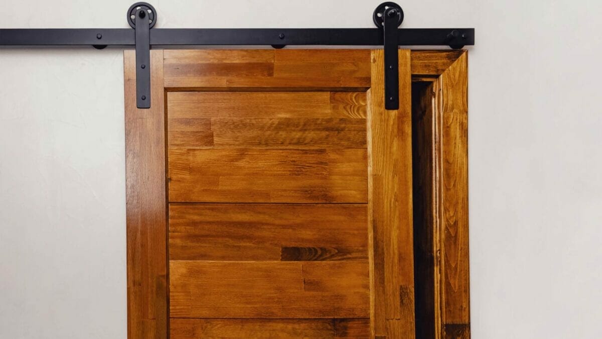 23 Outdated Home Trends Millennials Hate, But Boomers Love 14 sliding barn door