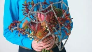 9 Ugly Flowers That Stand Out for All the Wrong Reasons 1 man holding ugly flowers