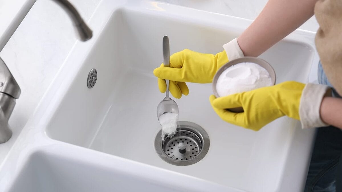 14 Clever Ways to Use Baking Soda Around the House - baking soda on drain ss1943077864