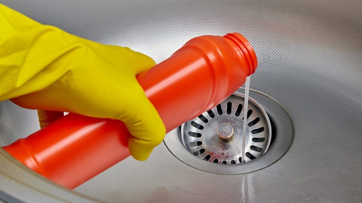 5 Pests Likely to Invade Your Drains This Fall (and How to Stop Them) 8 5 Pests Likely to Invade Your Drains This Fall (and How to Stop Them) - pouring chemical on drain ss2159785061