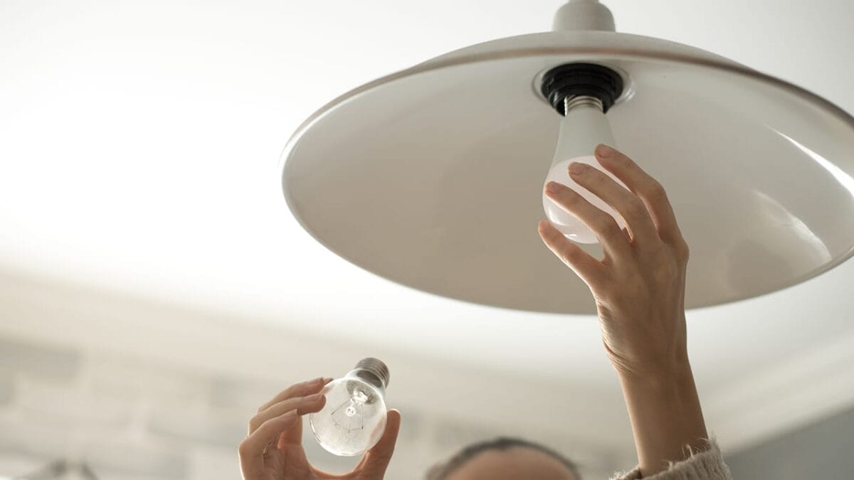 Avoid These 14 Energy Traps Draining Power—and Your Wallet 8 Avoid These 14 Energy Traps Draining Power—and Your Wallet - replacing light bulb ss539802514