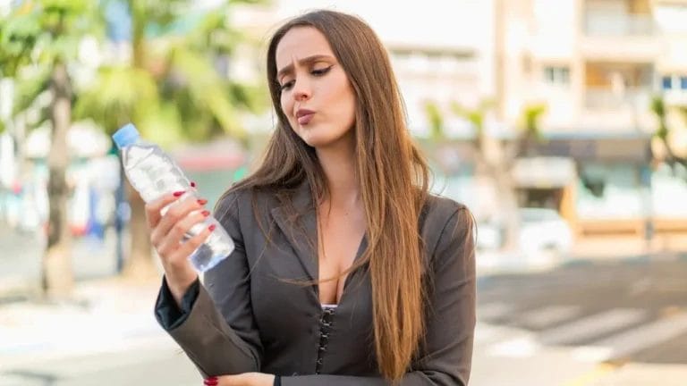 Bottled Water Expiration: Myth or Reality? Here’s What You Need to Know 6 Bottled Water Expiration: Myth or Reality? Here’s What You Need to Know - woman bottled water ss2322182589