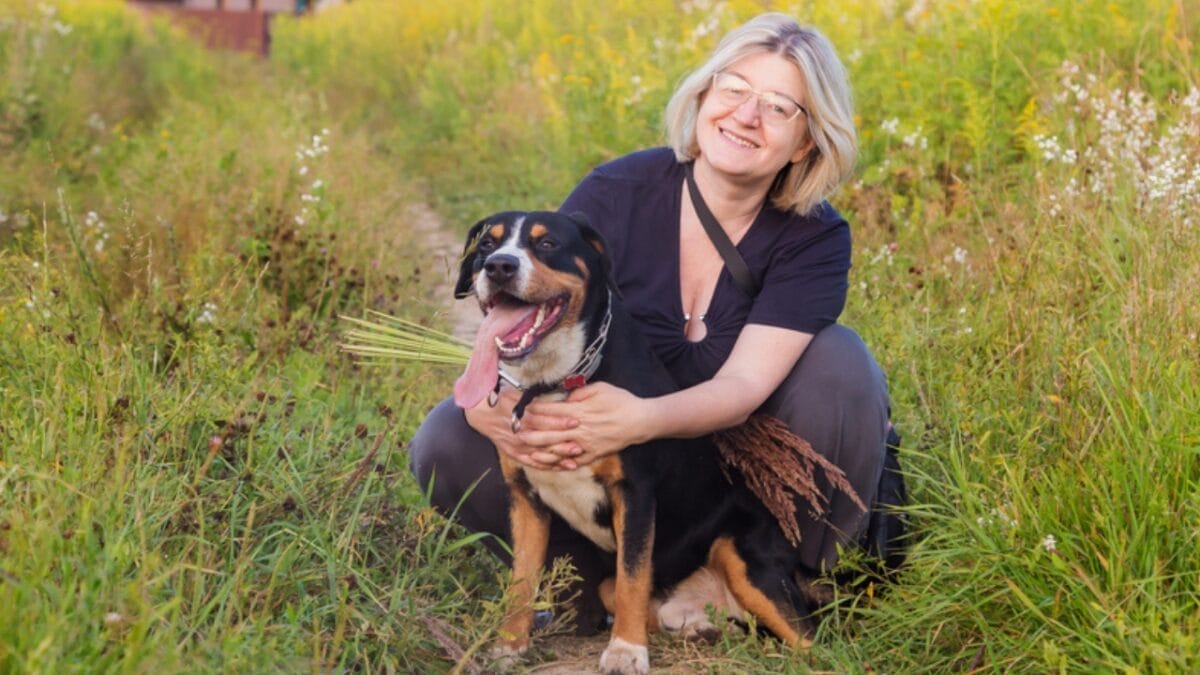 Meet the Entlebucher Mountain Dog: 10 Facts About This Swiss Breed 8 Meet the Entlebucher Mountain Dog: 10 Facts About This Swiss Breed - entlebucher dog with owner ss1841055586