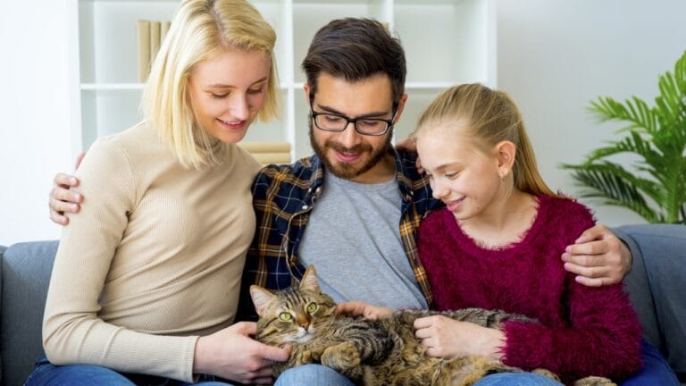 Cat Communication 101: Do Cats Dig Baby Talk & Know Their Names? 6 Cat Communication 101: Do Cats Dig Baby Talk & Know Their Names? - family with cat sitting ss709894567