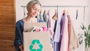 5 Decluttering Rules Pros Swear By for a Clutter-Free Home 1 5 Decluttering Rules Pros Swear By for a Clutter-Free Home - happy woman decluttering clothes ss2152075209