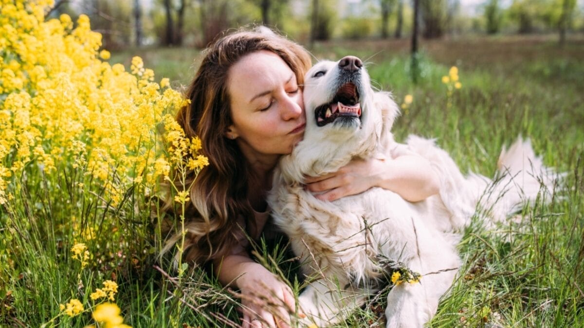 10 Reasons Why Older Dogs Make the Best Pets - woman and her golden retriever dog ss2197795191