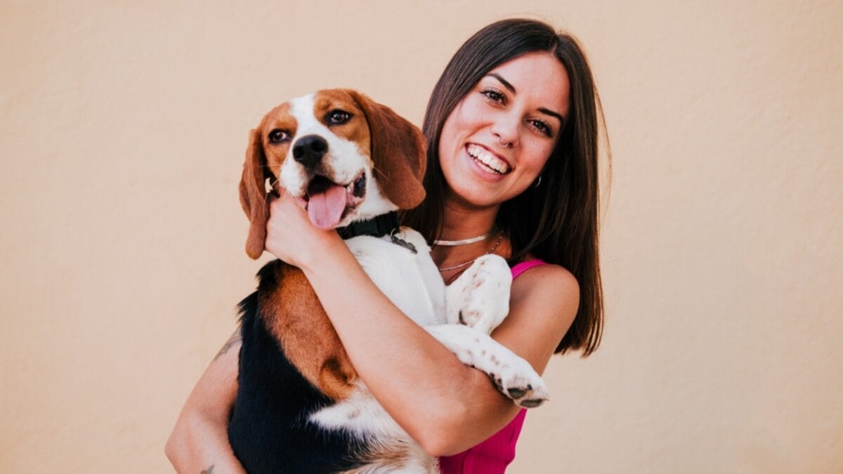 Dog Breeds: All Types from Small to Giant, Personalities & Characteristics 64 Dog Breeds: All Types from Small to Giant, Personalities & Characteristics - woman with beagle ss1799536885