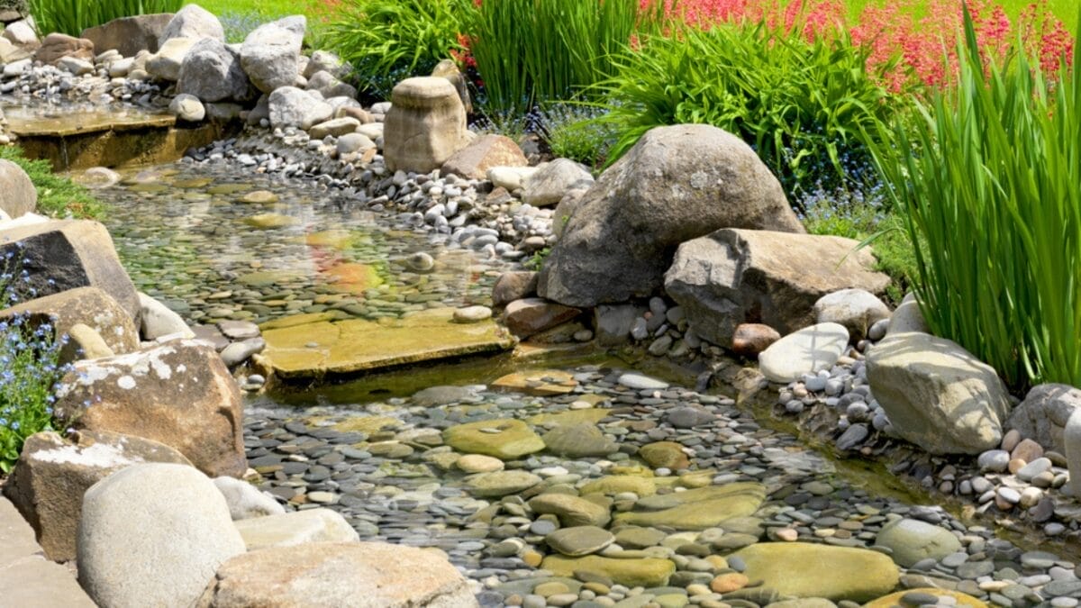Zen & the Art of Rock Placement: 21 Tranquil Boulder Landscaping Ideas 20 Zen & the Art of Rock Placement: 21 Tranquil Boulder Landscaping Ideas - Garden with Pond dp21806583