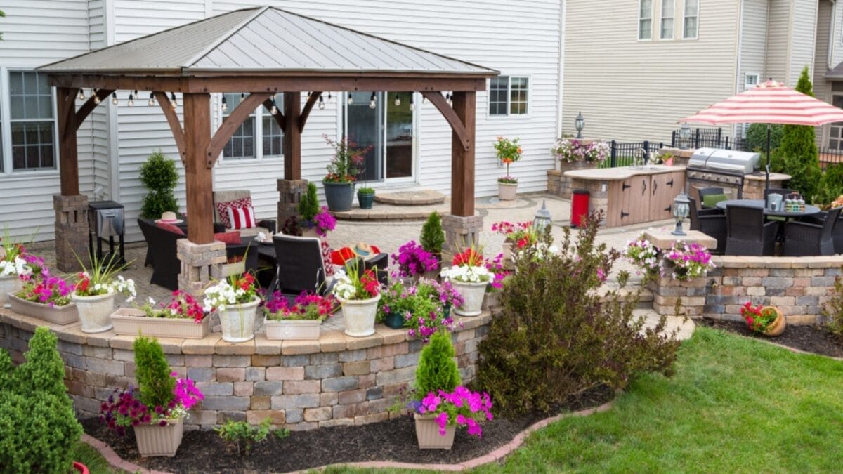 12 Budget-Friendly Home Renovations That Offer the Highest Returns 11 12 Budget-Friendly Home Renovations That Offer the Highest Returns - Patio With Flower ss1141351856