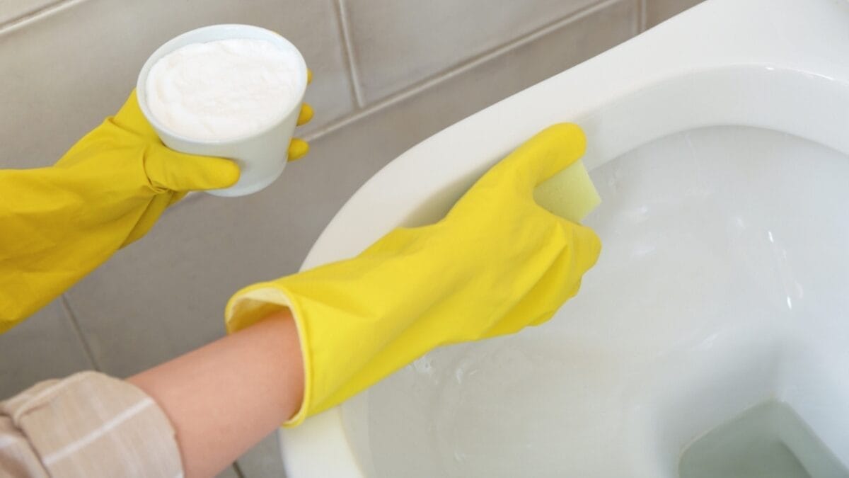10 Frustrating Spots to Clean & How to Make the Job Easier 9 10 Frustrating Spots to Clean & How to Make the Job Easier - baking soda with gloves toilet ss2407373353