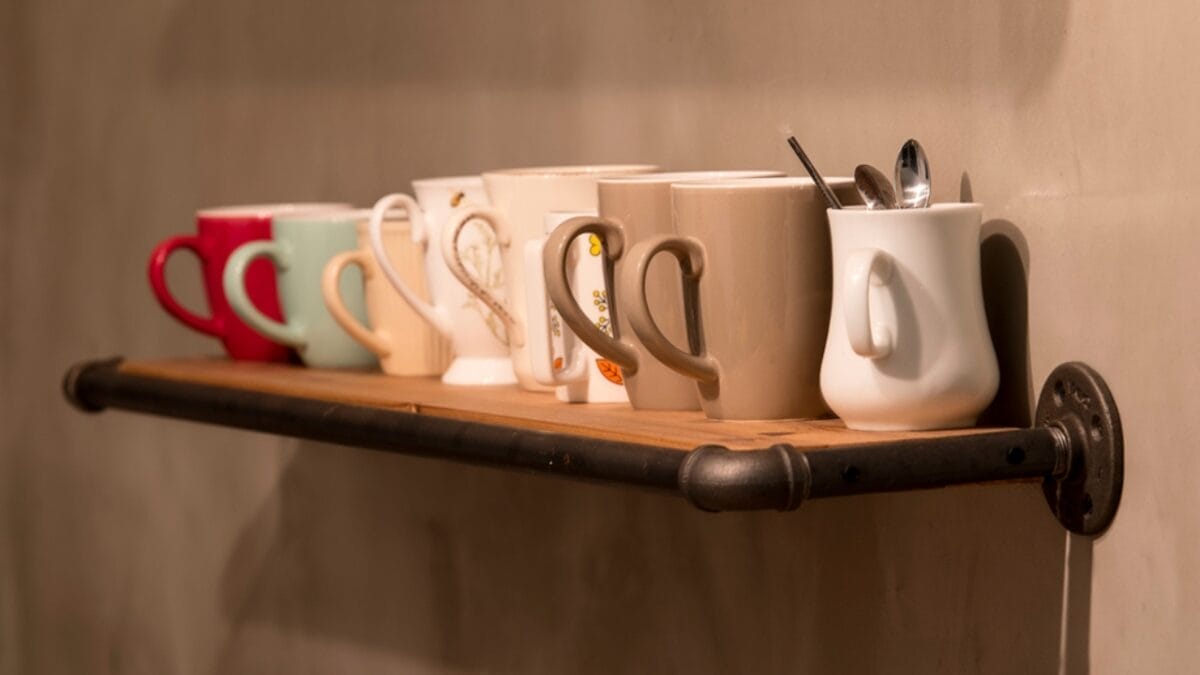 10 Kitchen Items You Need to Get Rid of Immediately - mugs on shelf ss1871133814