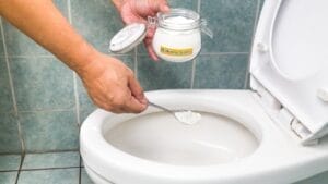 Ditch Your Toilet Brush—Try This Baking Soda Hack Instead 1 Ditch Your Toilet Brush—Try This Baking Soda Hack Instead - toilet with baking soda ss310525373