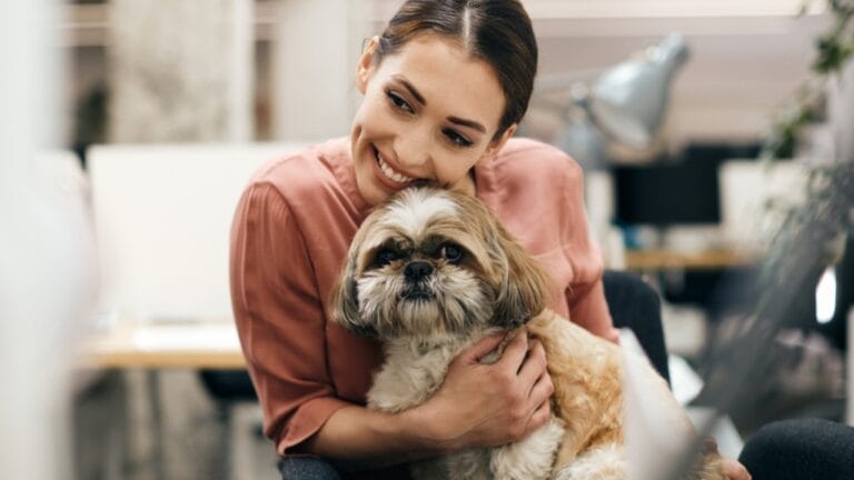 9 Shih Tzu Tips Every New Dog Parent Needs to Know 8 9 Shih Tzu Tips Every New Dog Parent Needs to Know - woman hugging shih tzu dog ss1983774782