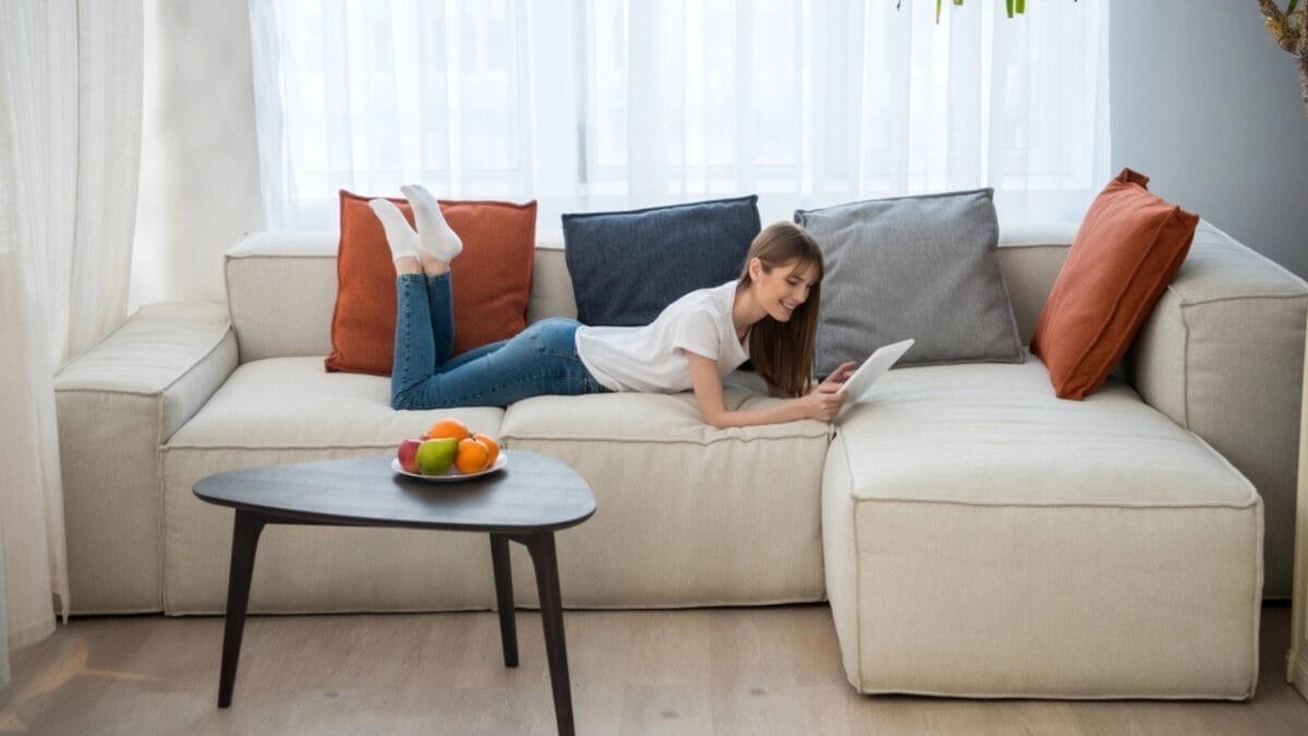 15 Home Decor Hacks to Boost Your Well-Being & Happiness 15 15 Home Decor Hacks to Boost Your Well-Being & Happiness - woman in couch dp185656074