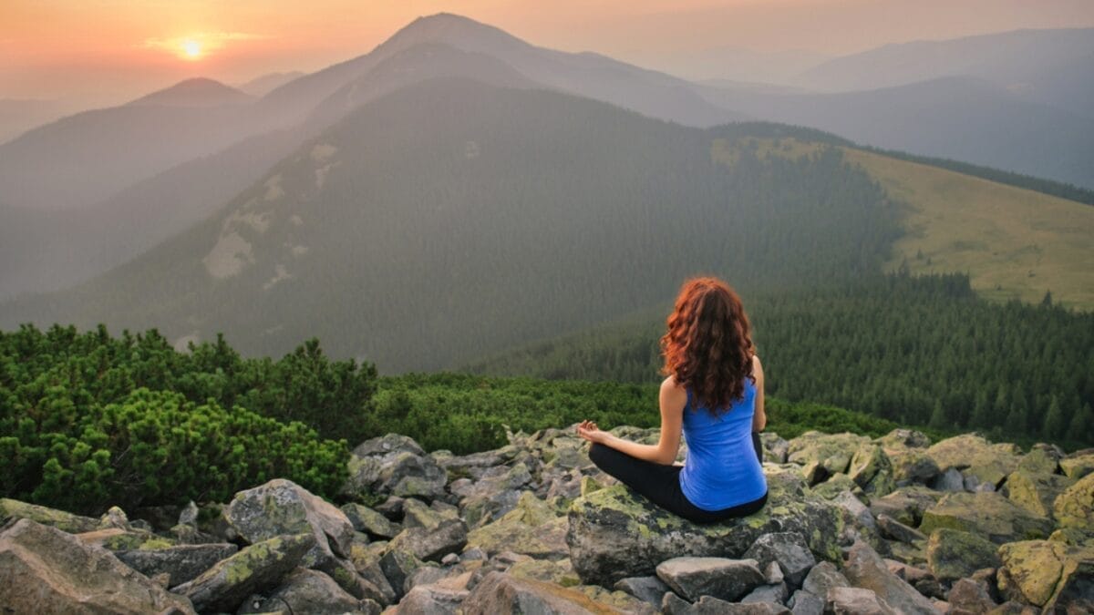 10 Powerful Ways Nature Enhances Your Mental Health 6 10 Powerful Ways Nature Enhances Your Mental Health - woman in mountain dp82157886