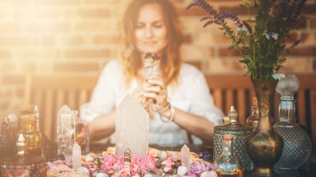 Are You a Magnet for Negativity? Use These 8 Crystals to Help Ward off Bad Vibes 11 Are You a Magnet for Negativity? Use These 8 Crystals to Help Ward off Bad Vibes - woman with crystal smiling ss2185874551