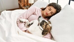 Pets May Know Exactly When They're Dying & The Emotional Last Act for Their Owners 1 Pets May Know Exactly When They're Dying & The Emotional Last Act for Their Owners - dog with owner in bed dp542222216