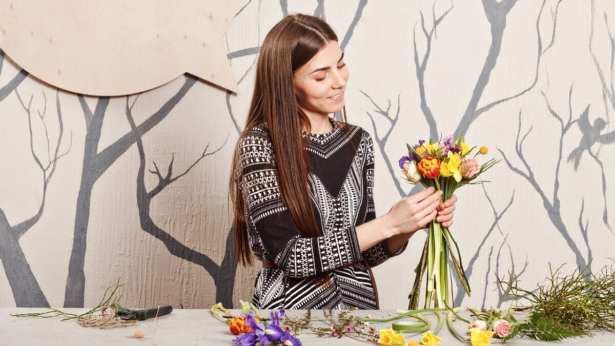 36 Calming Slow Living Hobbies & Habits for Ultimate Relaxation 34 36 Calming Slow Living Hobbies & Habits for Ultimate Relaxation - girl flower arranging dp65779507