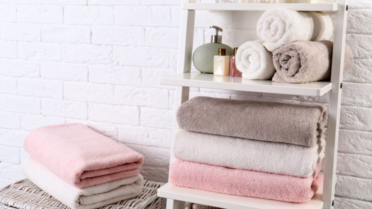 Stop Storing These 15 Things in the Bathroom—Here’s Why 6 Stop Storing These 15 Things in the Bathroom—Here’s Why - towel storage ss1387627238