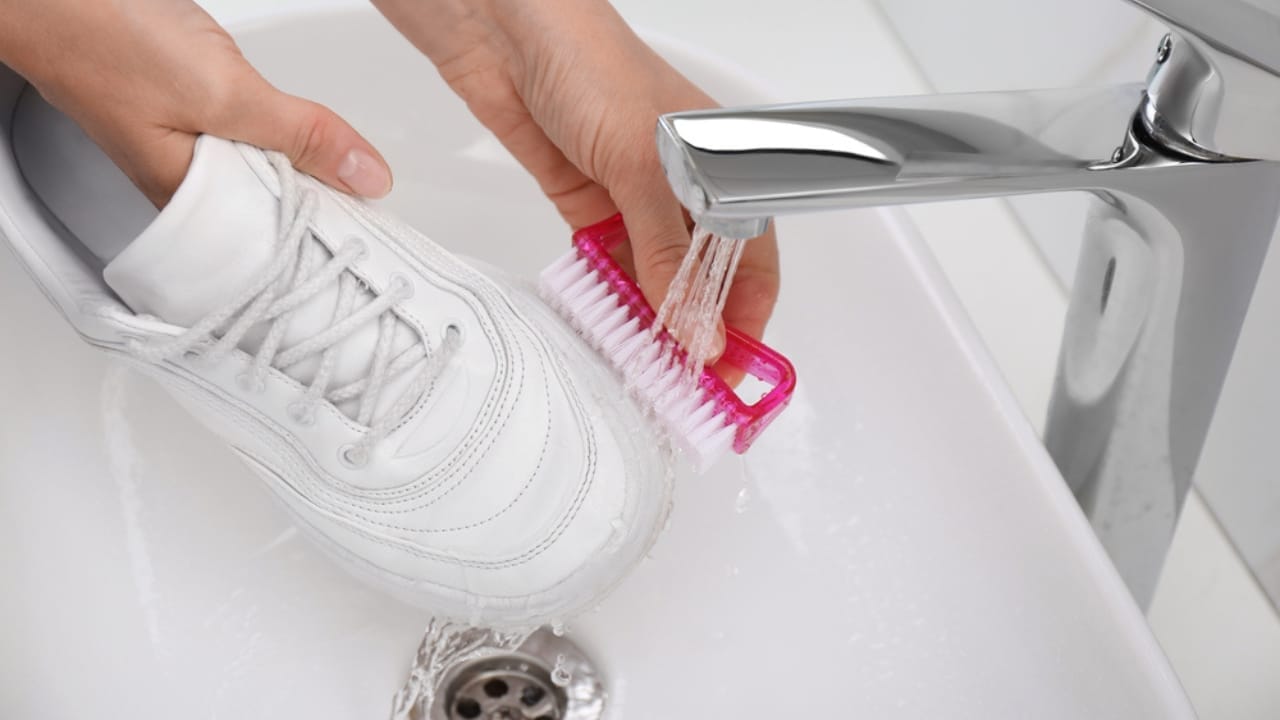 11 Uses of the Magic Eraser–the Cleaning Tool You Never Knew You Needed 7 11 Uses of the Magic Eraser–the Cleaning Tool You Never Knew You Needed - woman cleaning shoes dp473834116