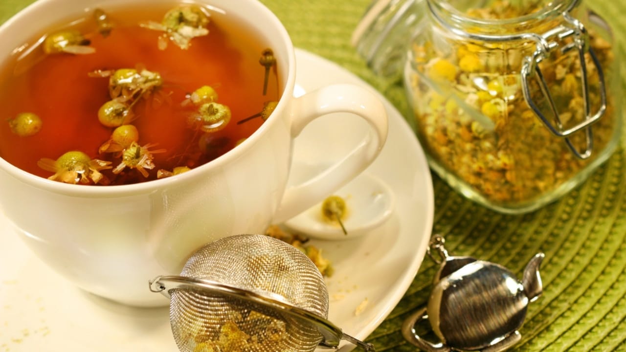 10 Anti-Inflammatory Teas to Boost Your Health 5 10 Anti-Inflammatory Teas to Boost Your Health - Chamomile tea with white cup dp3266615