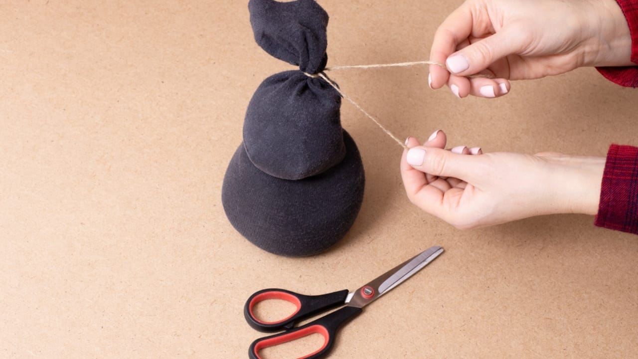 Old Socks, New Purpose: 20 Clever Ways to Reuse Them 8 Old Socks, New Purpose: 20 Clever Ways to Reuse Them - Tied stuffed sock ss1905121651