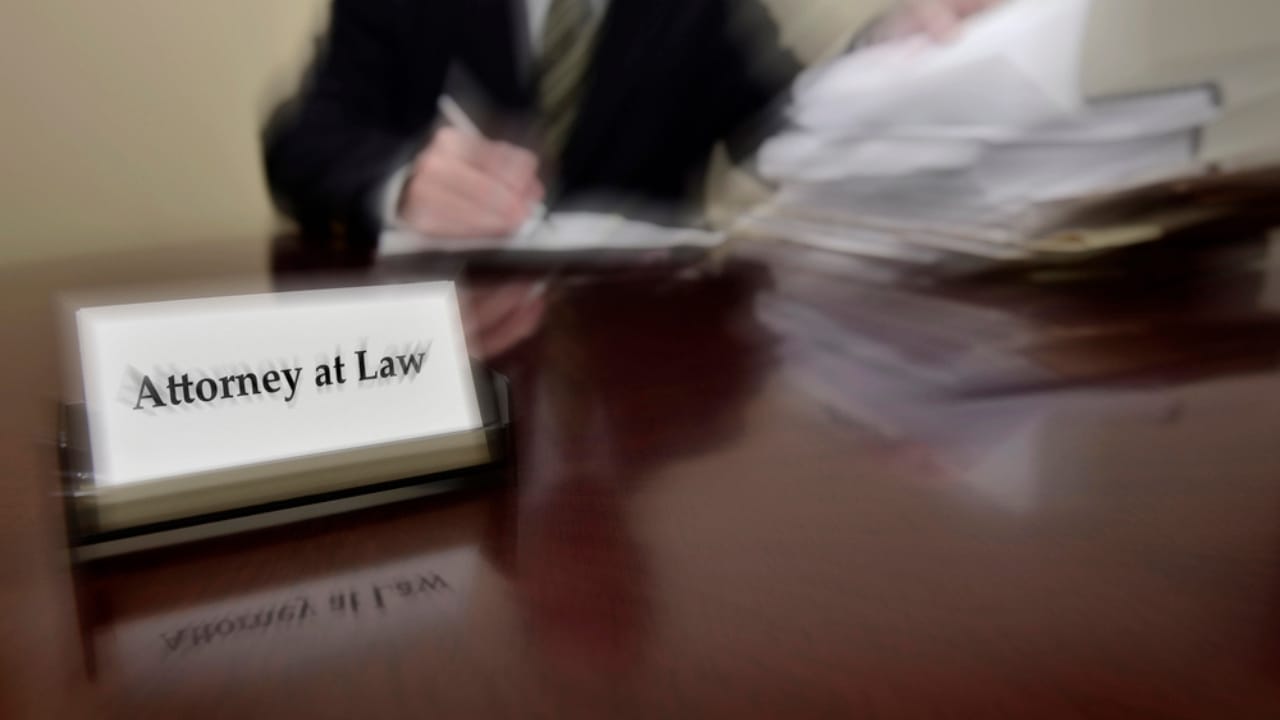 15 Situations Where Unenforceable HOA Rules Deserve to Be Challenged - attorney at desk dp62180531