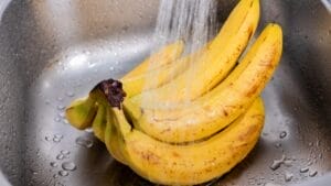 Don't Skip Washing Your Bananas: Here's Why It's Important 1 Don't Skip Washing Your Bananas: Here's Why It's Important - bananas being washed ss2403986385