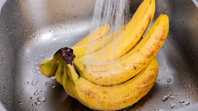 Don't Skip Washing Your Bananas: Here's Why It's Important 1 Don't Skip Washing Your Bananas: Here's Why It's Important - bananas being washed ss2403986385