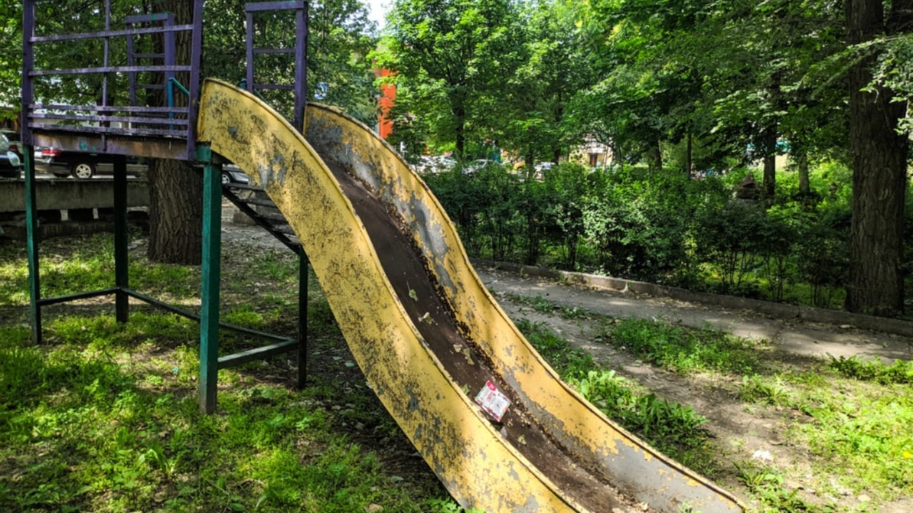 15 Situations Where Unenforceable HOA Rules Deserve to Be Challenged - broken slides in park dp273176484