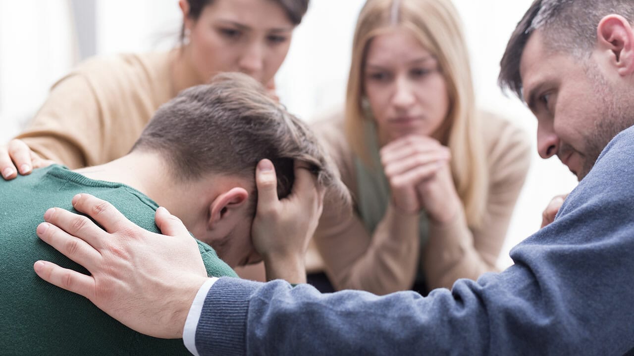 12 Heartfelt Ways to Support Someone Grieving the Loss of a Pet 9 12 Heartfelt Ways to Support Someone Grieving the Loss of a Pet - friends comforting man ss452653663