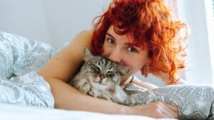 12 British Cat Breeds That Have Captured Hearts for Centuries 1 12 British Cat Breeds That Have Captured Hearts for Centuries - girl with maine coon cat ss2454331187