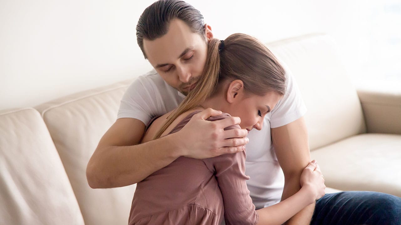 12 Heartfelt Ways to Support Someone Grieving the Loss of a Pet 5 12 Heartfelt Ways to Support Someone Grieving the Loss of a Pet - hugging couple ss635839790