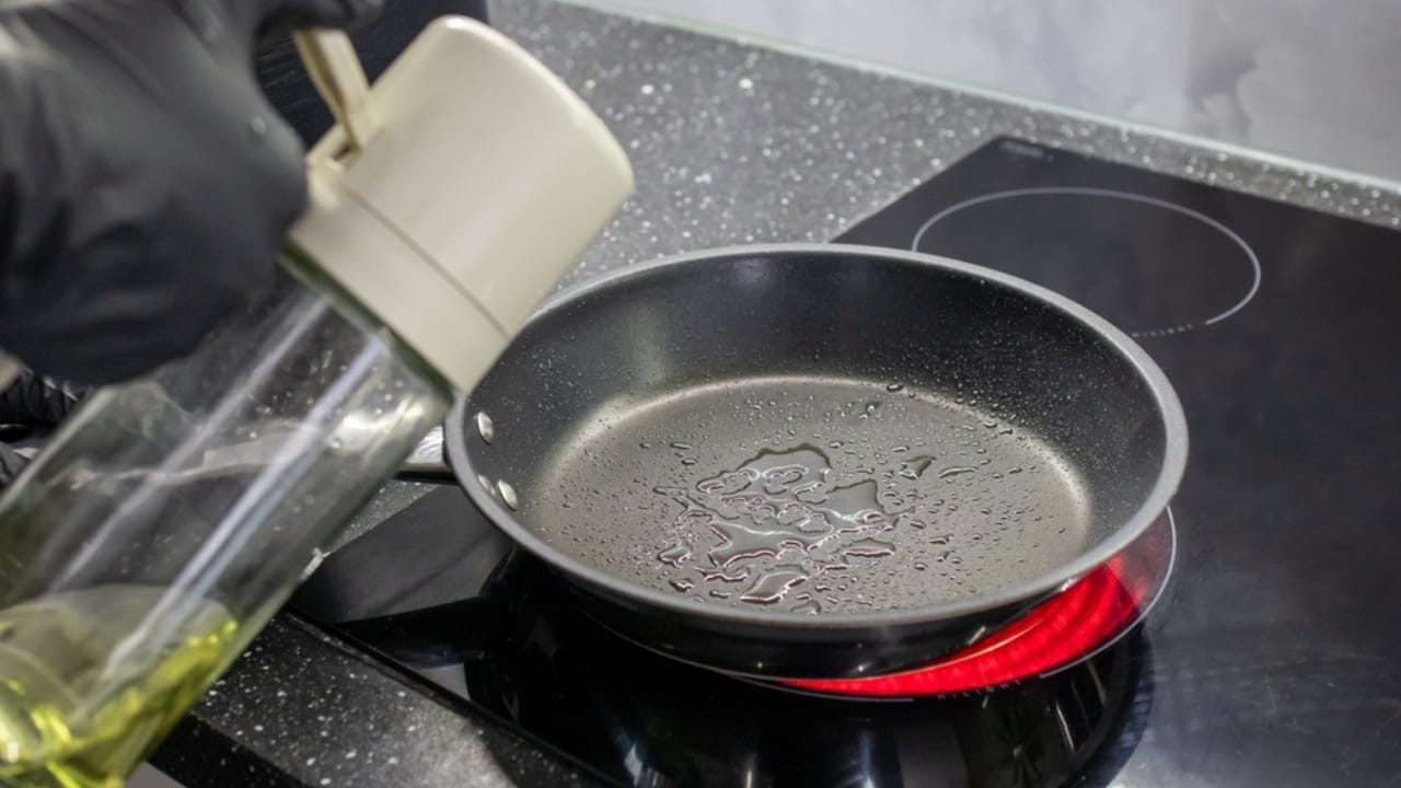 How to Make the Perfect Cast Iron Skillet Burger: 12 Pro Tips 6 How to Make the Perfect Cast Iron Skillet Burger: 12 Pro Tips - pre heating and putting oil in skillet ss2486876079