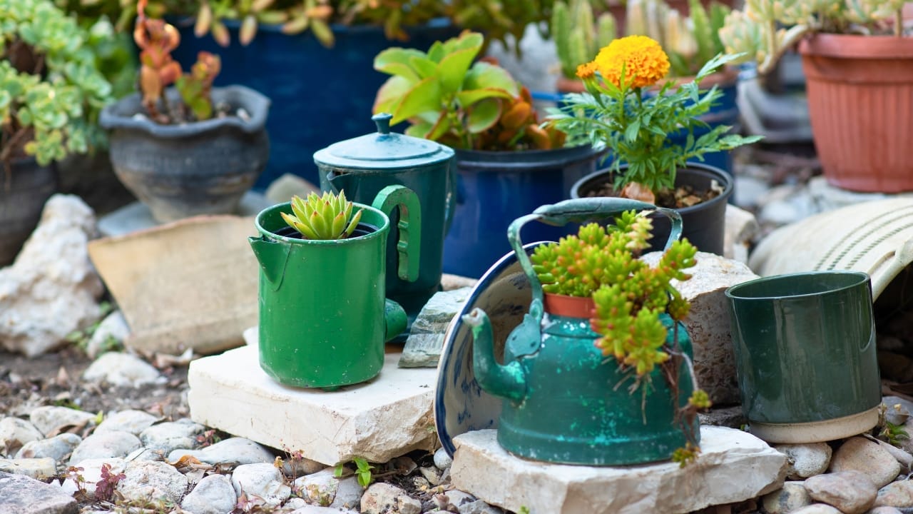 16 Unconventional Garden Containers to Spice Up Your Outdoor Space - teapot planter ss1781257199