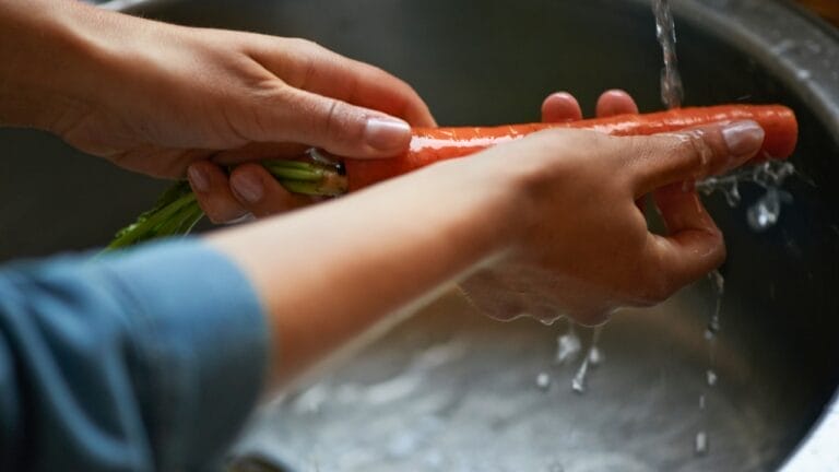 Washing Produce Isn't Enough to Remove Pesticides, Study Finds — Here's a Better Solution 6 Washing Produce Isn't Enough to Remove Pesticides, Study Finds — Here's a Better Solution - washing carrot ss2428703729