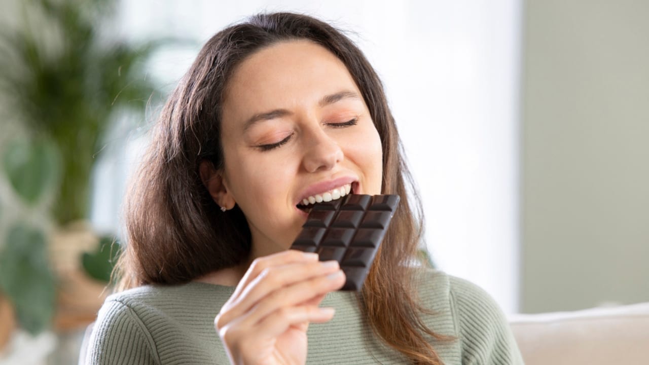 Toxic Metals Linked to Cancer Found in Popular Brands of Dark Chocolate 4 Toxic Metals Linked to Cancer Found in Popular Brands of Dark Chocolate - woman eating dark chocolate dp506832804