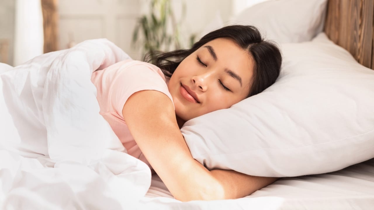 8 Ways a Bay Leaf in Your Socks Can Boost Your Day - woman sleeping dp373786932